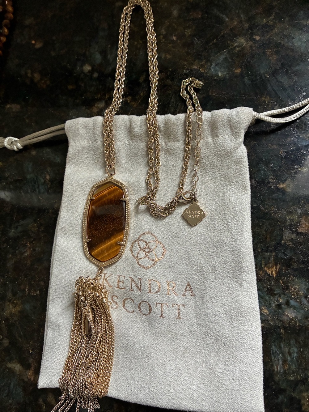 Kendra Scott gold Rayne necklace in tigers eye.